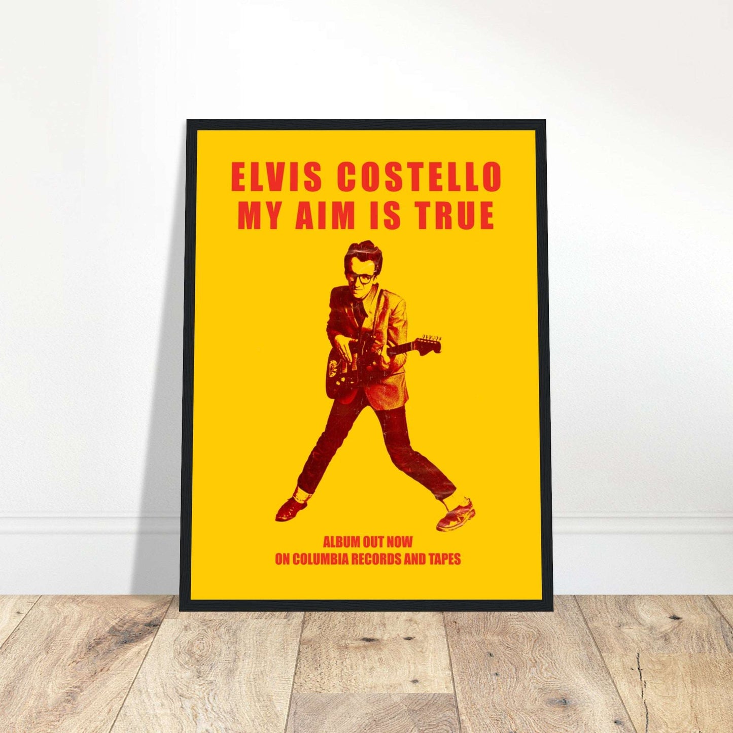 Iconic Elvis Costello poster, celebrating the legendary new wave and punk rock artist. Perfect for collectors & music lovers. Shop now!