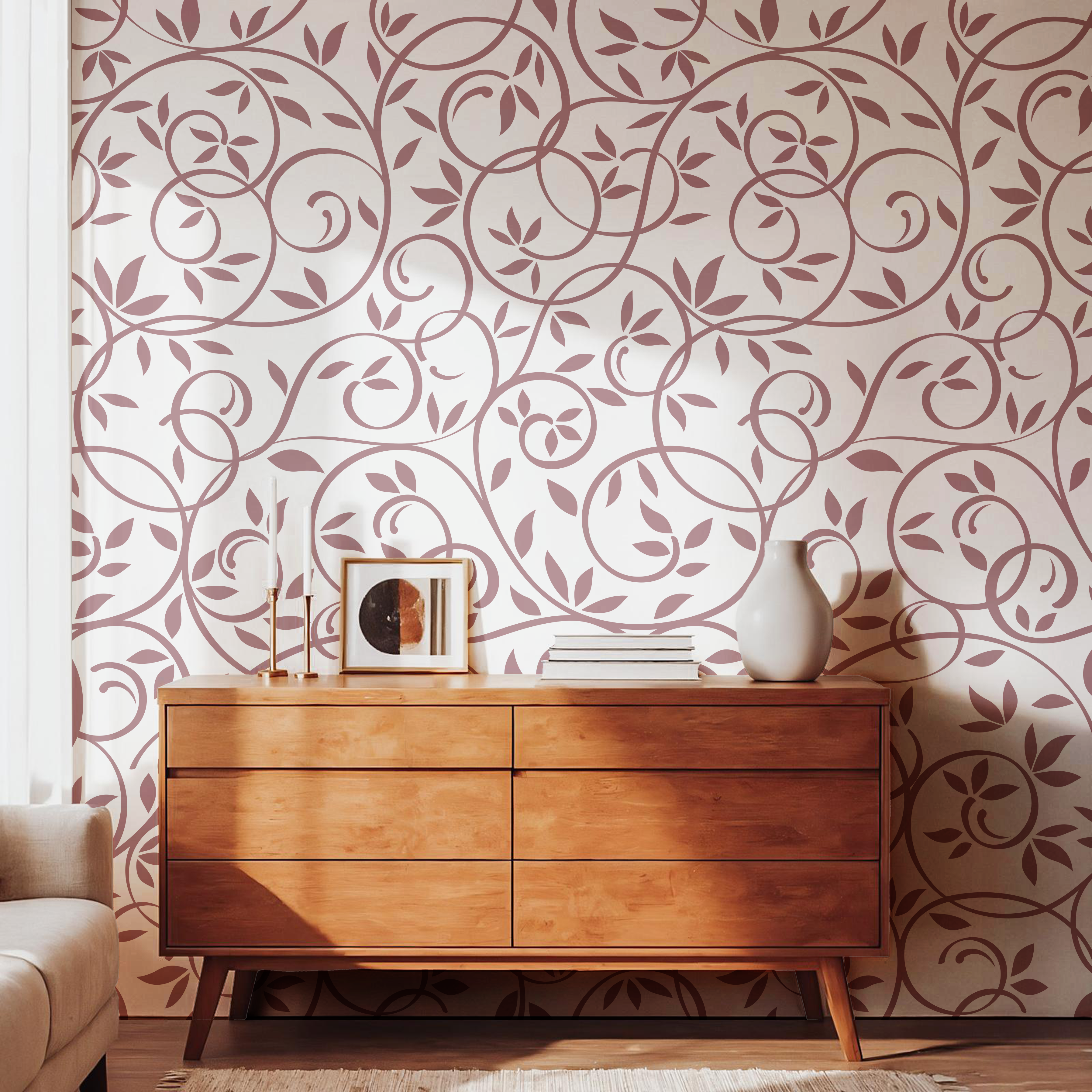 Dusty rose leaf and vine wallpaper styled with a natural wooden dresser
