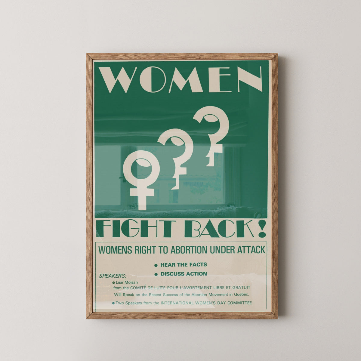 Women Fight Back Poster – 1970s Feminist Protest Art – light wood frame mockup