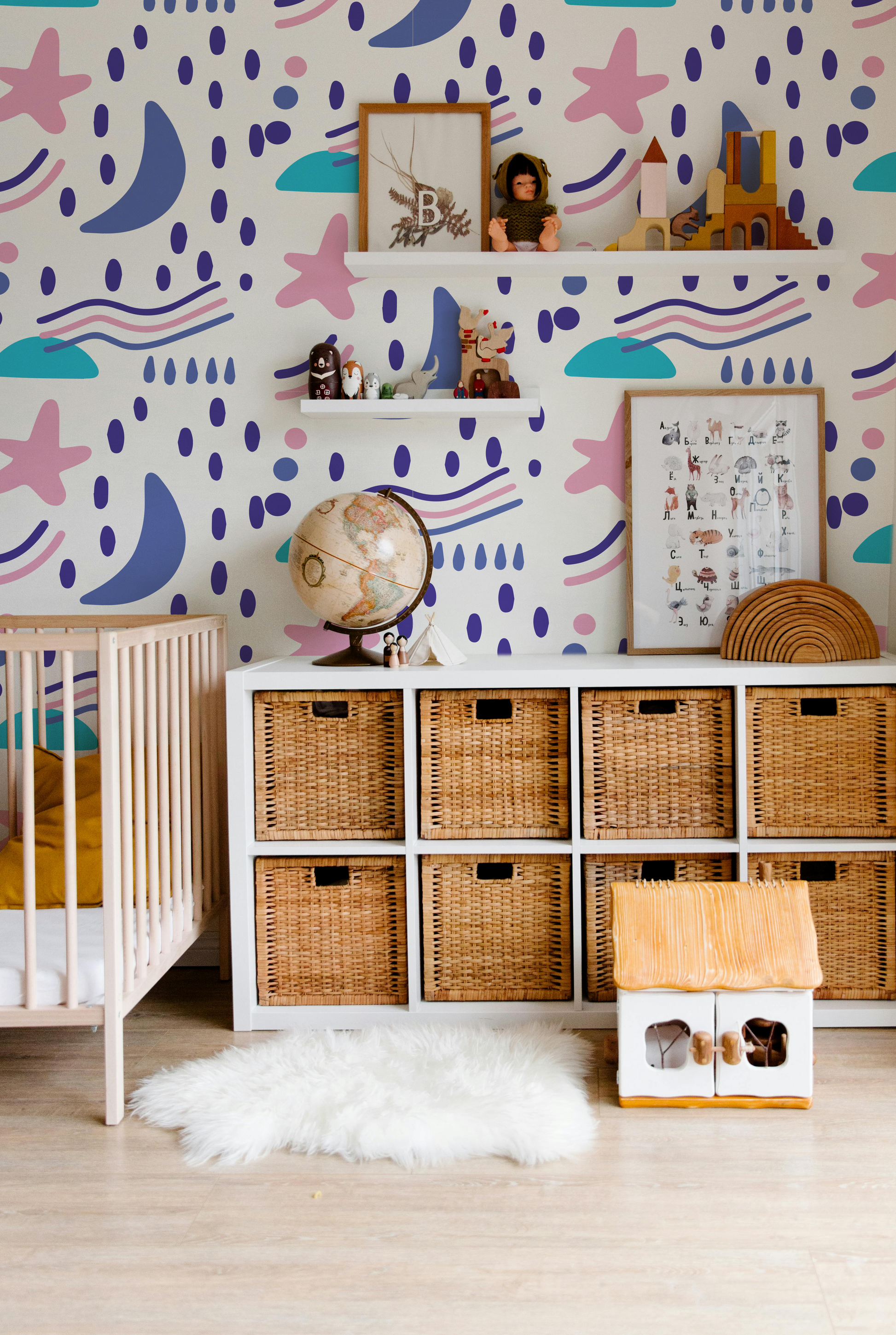 Luma Cosmic colorful kids wallpaper with stars moons and playful abstract shapes in a modern nursery