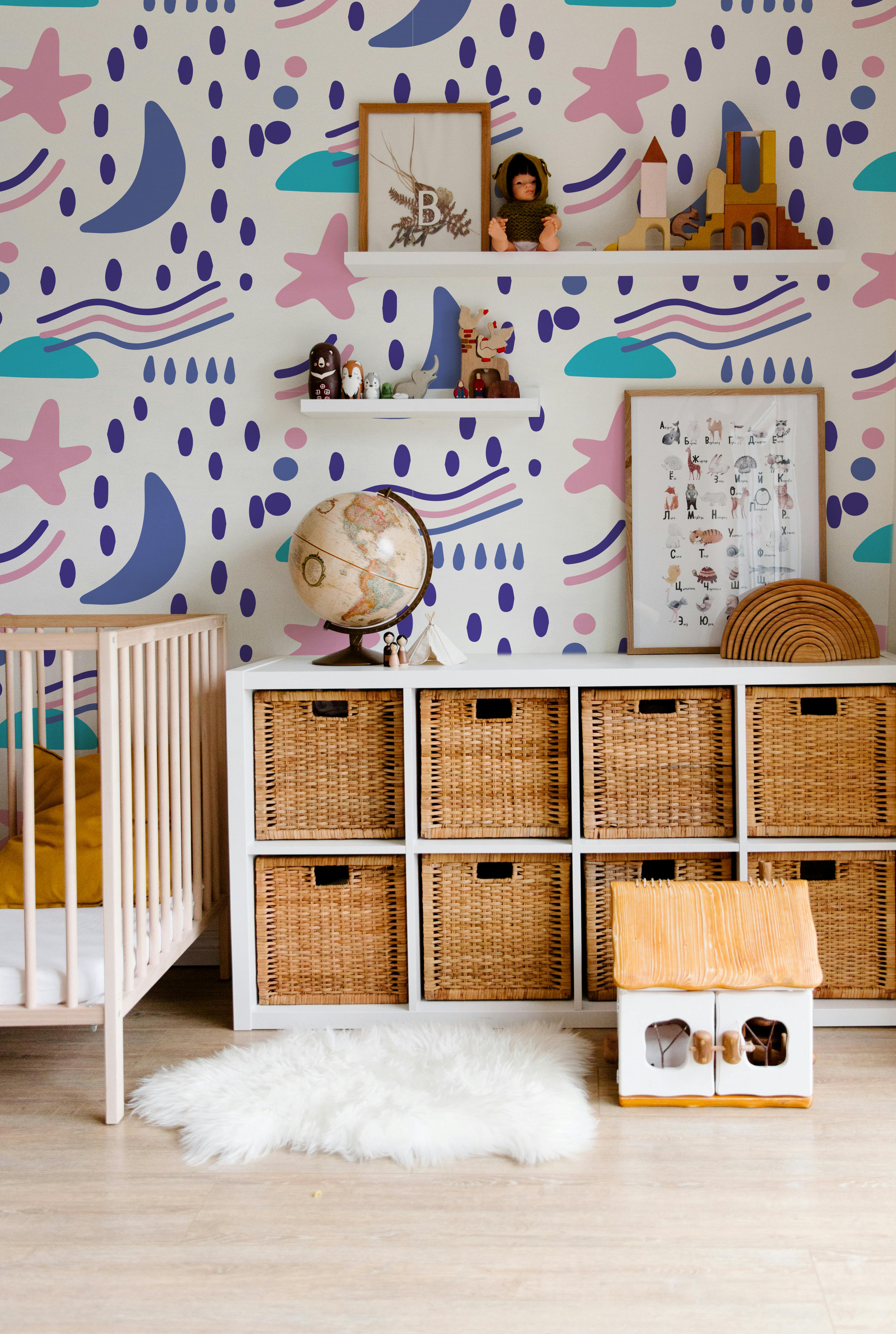 Luma Cosmic colorful kids wallpaper with stars moons and playful abstract shapes in a modern nursery