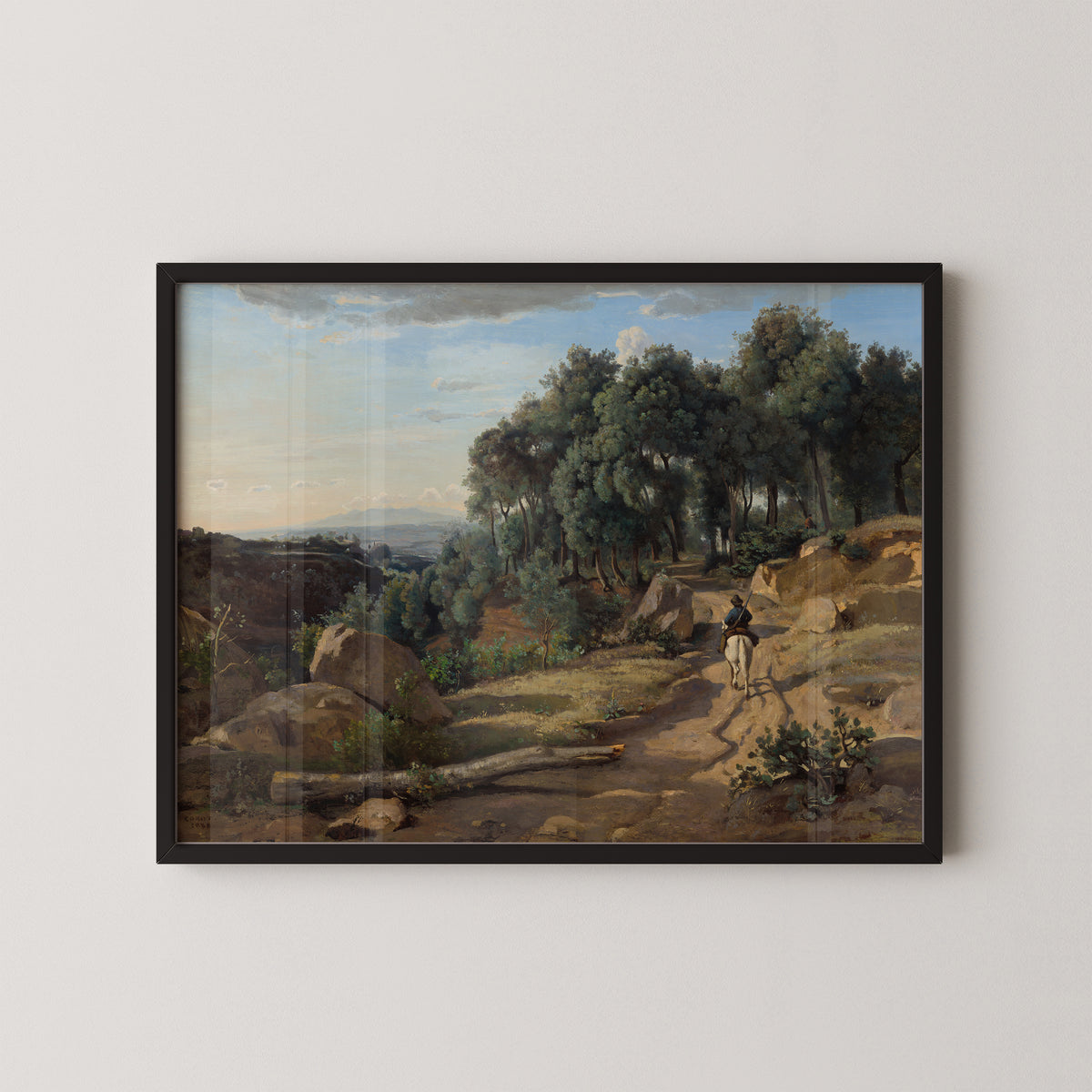A View near Volterra by Corot art print in a black frame, showing Tuscan path, trees and distant hills