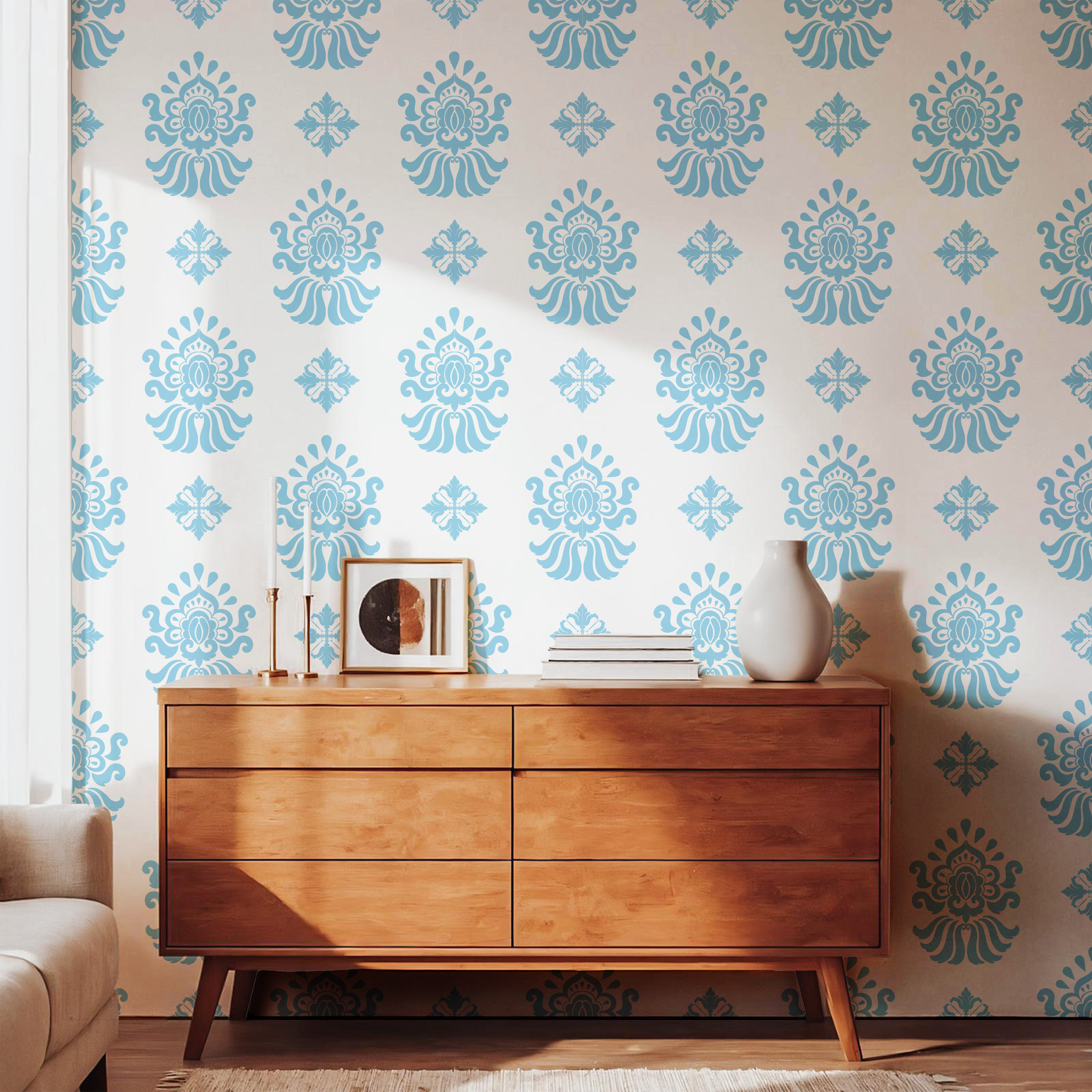 Light blue vintage floral wallpaper styled with a warm wooden dresser