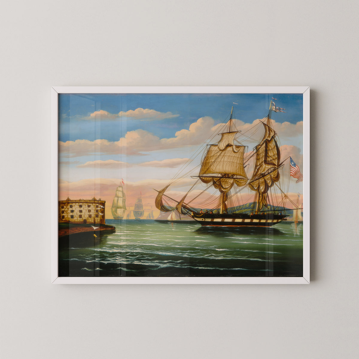 White-framed Thomas Chambers maritime print, with a large sailing ship, smaller boats and fortified shoreline