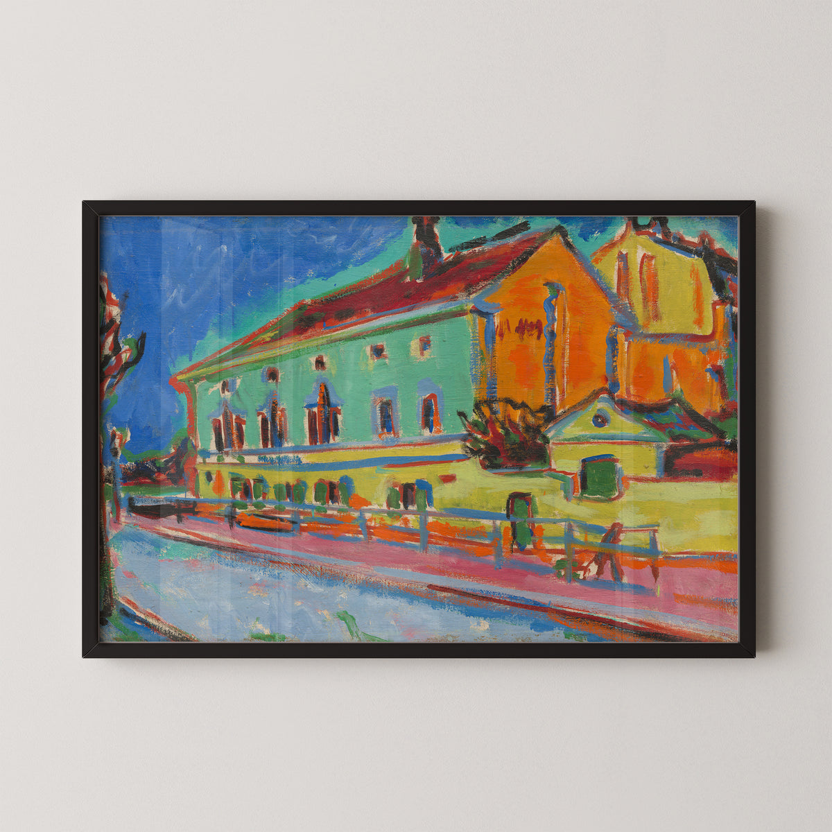 Dance Hall Bellevue by Ernst Ludwig Kirchner art print in a black frame, showing colorful waterfront building and boats