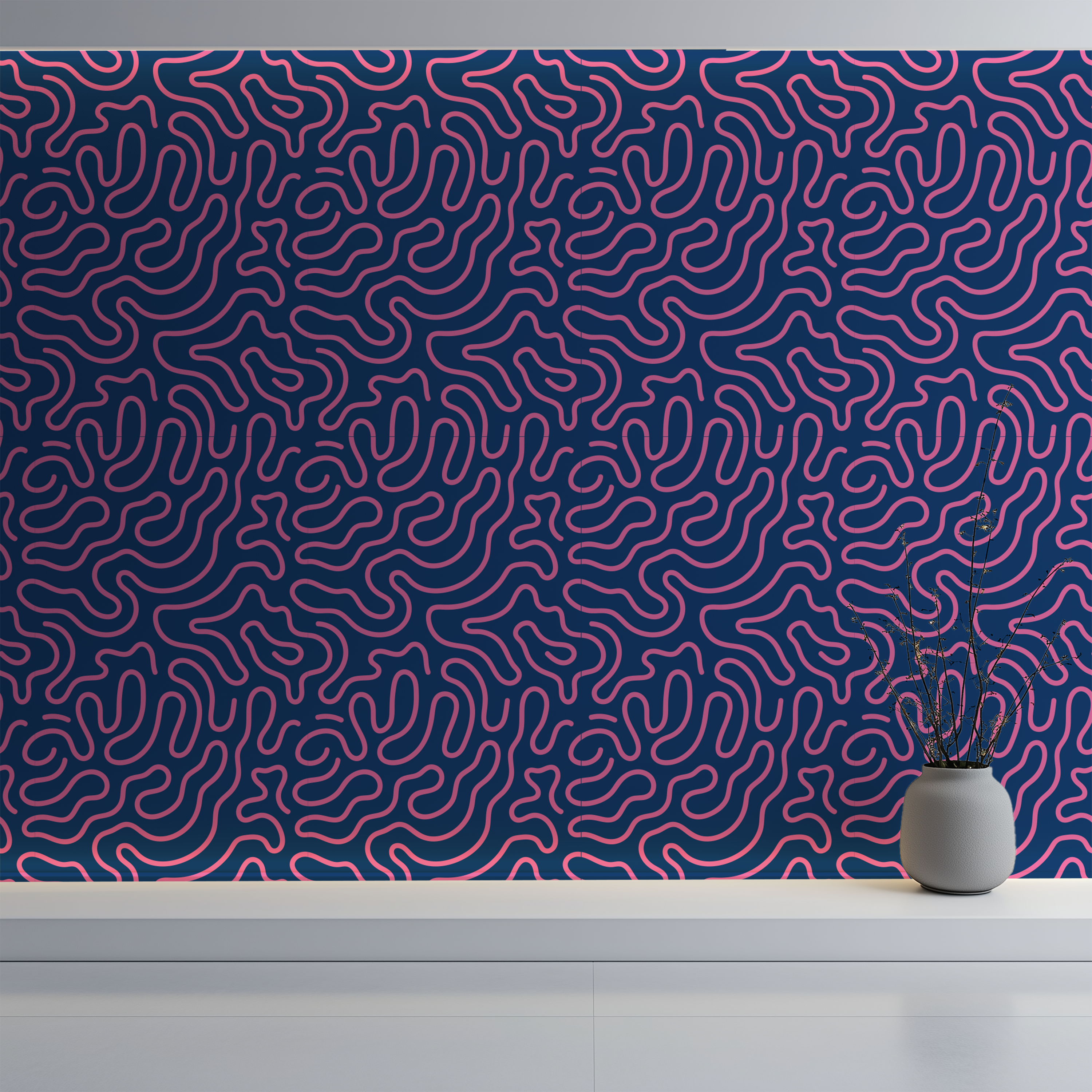 A wall covered in a repeating abstract maze-like line w in pink over a dark navy background, with a white shelf below and a small gray vase holding dried stems on the right.llpaper