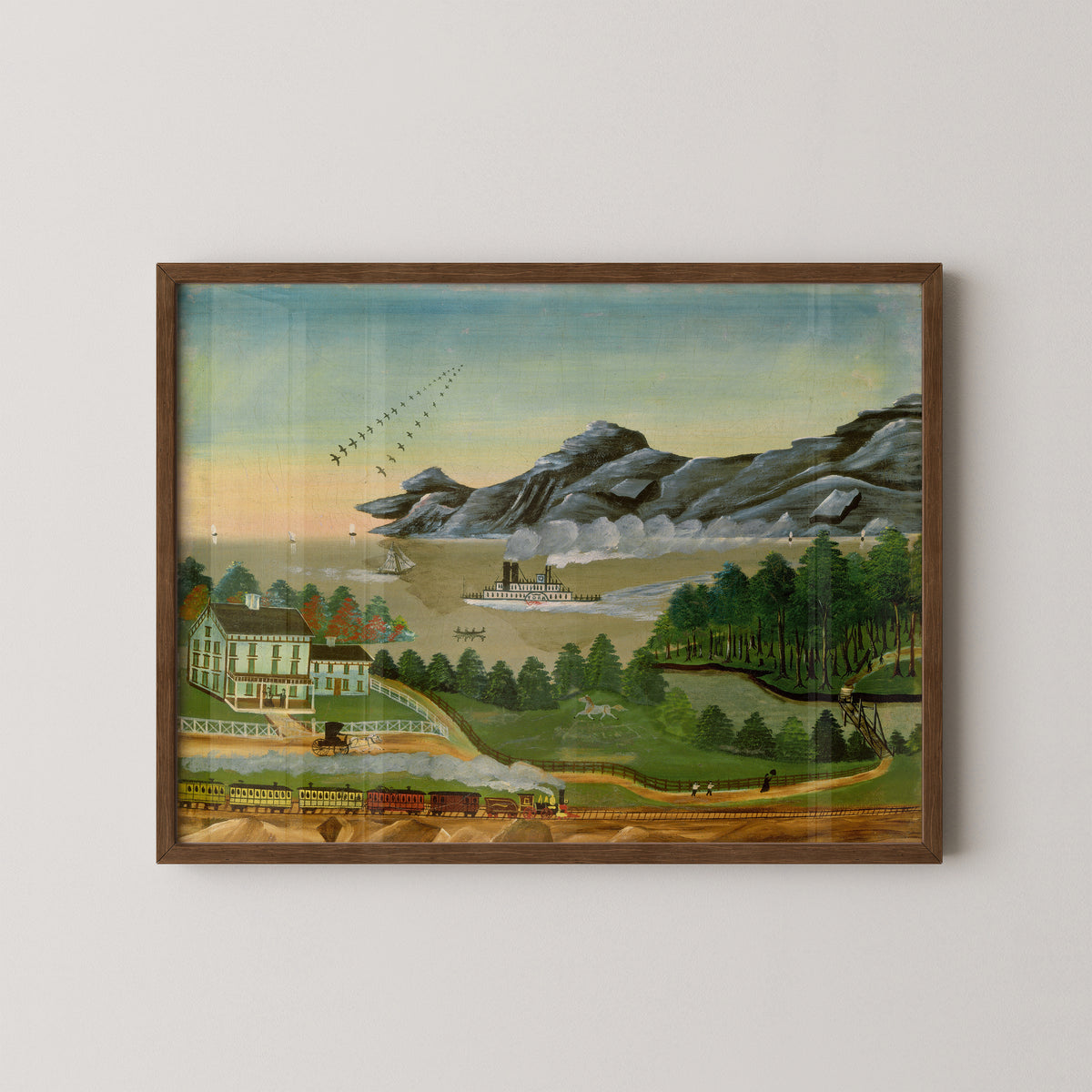 Geese in Flight by Leila T. Bauman art print in a dark wood frame, with flying geese above a river landscape