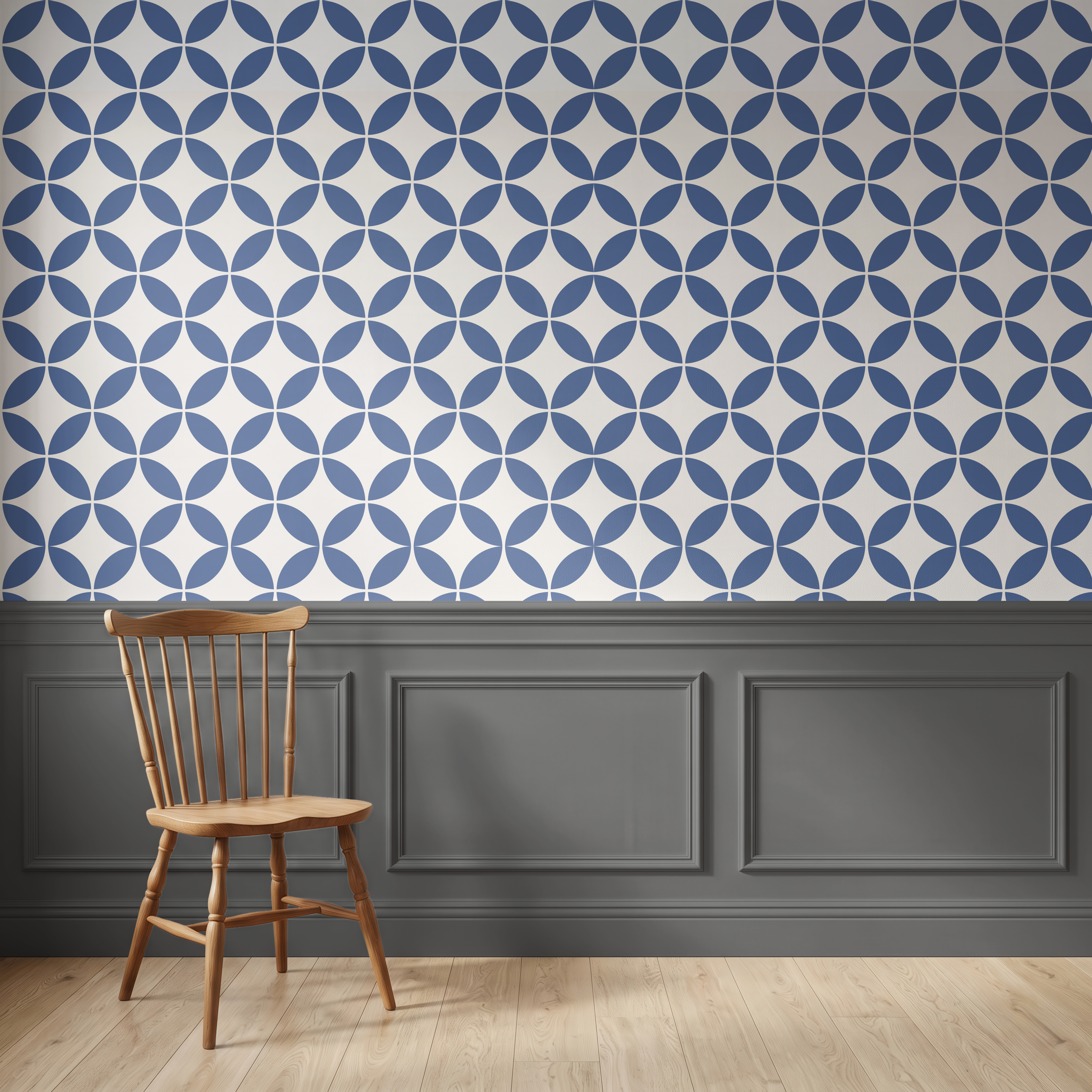Navy blue geometric wallpaper above traditional wall panelling with a wooden chair