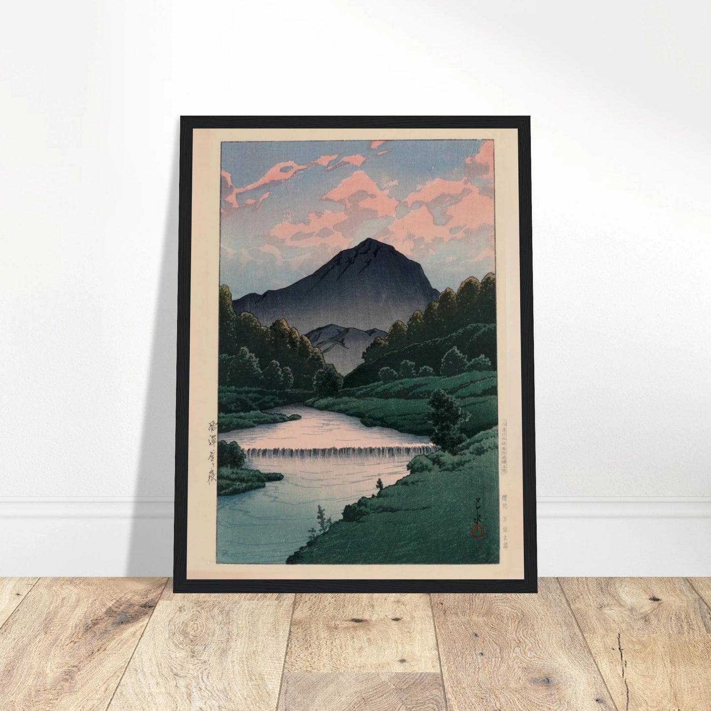 This faithful reproduction of Mount Kamagadake, Hida (Hida Kamagadake, c. 1940s) showcases the tranquil beauty of Kawase Hasui (1883–1957), one of the most celebrated artists of Japan’s Shin-Hanga movement. The artwork features Hasui’s signature and his distinctive red ink seal, capturing the serene atmosphere of Japan’s Hida Mountains in soft color and masterful composition. Originally published by Watanabe Shōzaburō, whose seal appears in the print, and printed by Ono Gintarō, this reproduction maintains 