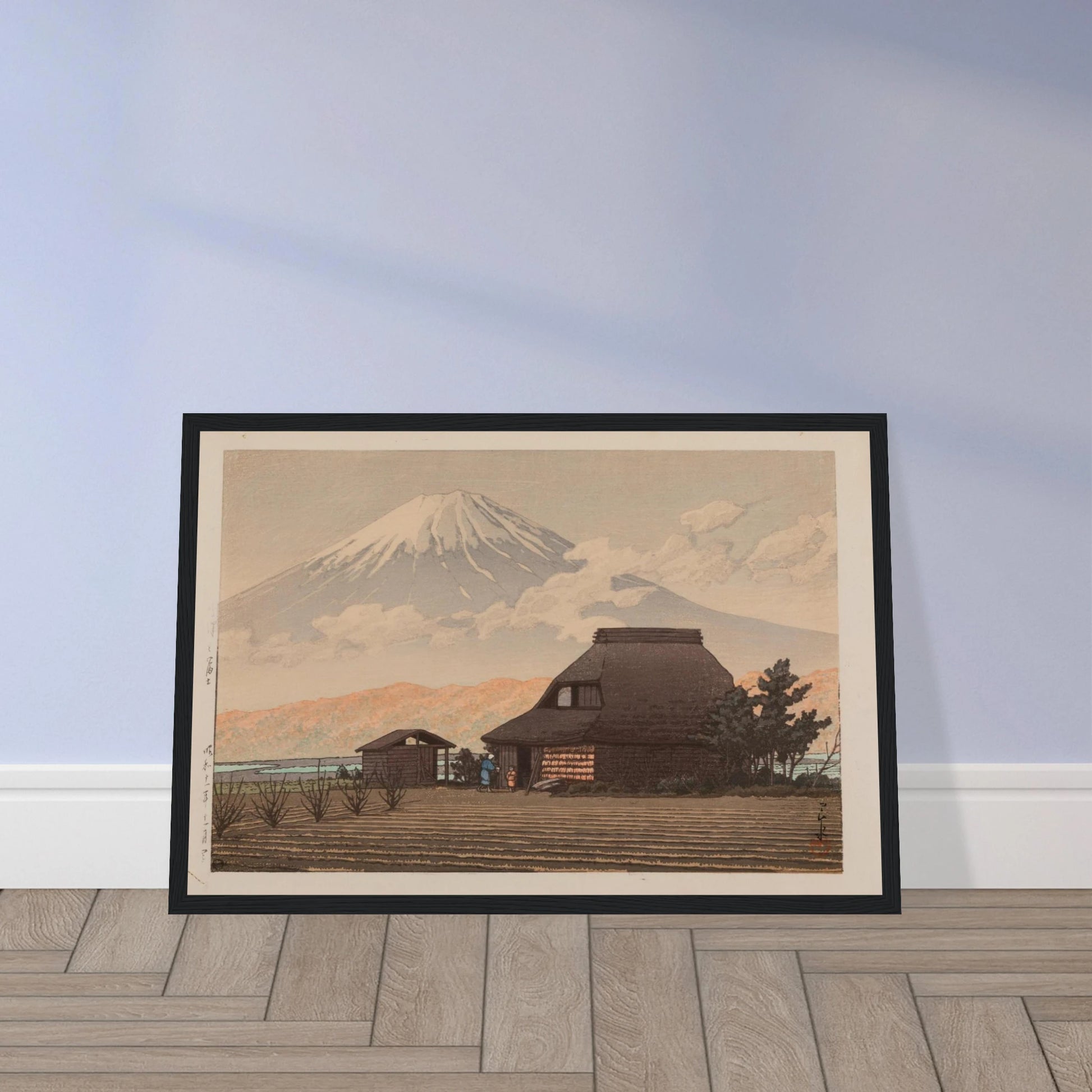 This fine reproduction of Mt. Fuji from Narusawa (Narusawa no Fuji, Showa 11 / 1936) showcases the breathtaking landscape vision of Kawase Hasui (1883–1957), a master of the Shin-Hanga movement. Signed by the artist and bearing his distinctive red ink seal, this peaceful scene of Mount Fuji rising behind the forests of Narusawa reflects Hasui’s talent for capturing Japan’s natural majesty with elegance and quiet emotion. Originally published by Watanabe Shōzaburō, whose seal is reproduced in this edition, t