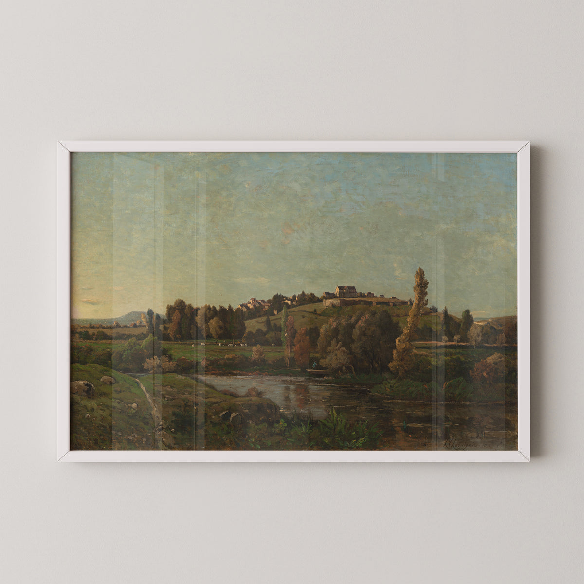 White-framed Landscape in Auvergne art print, showing a stream beneath trees and distant hillside buildings