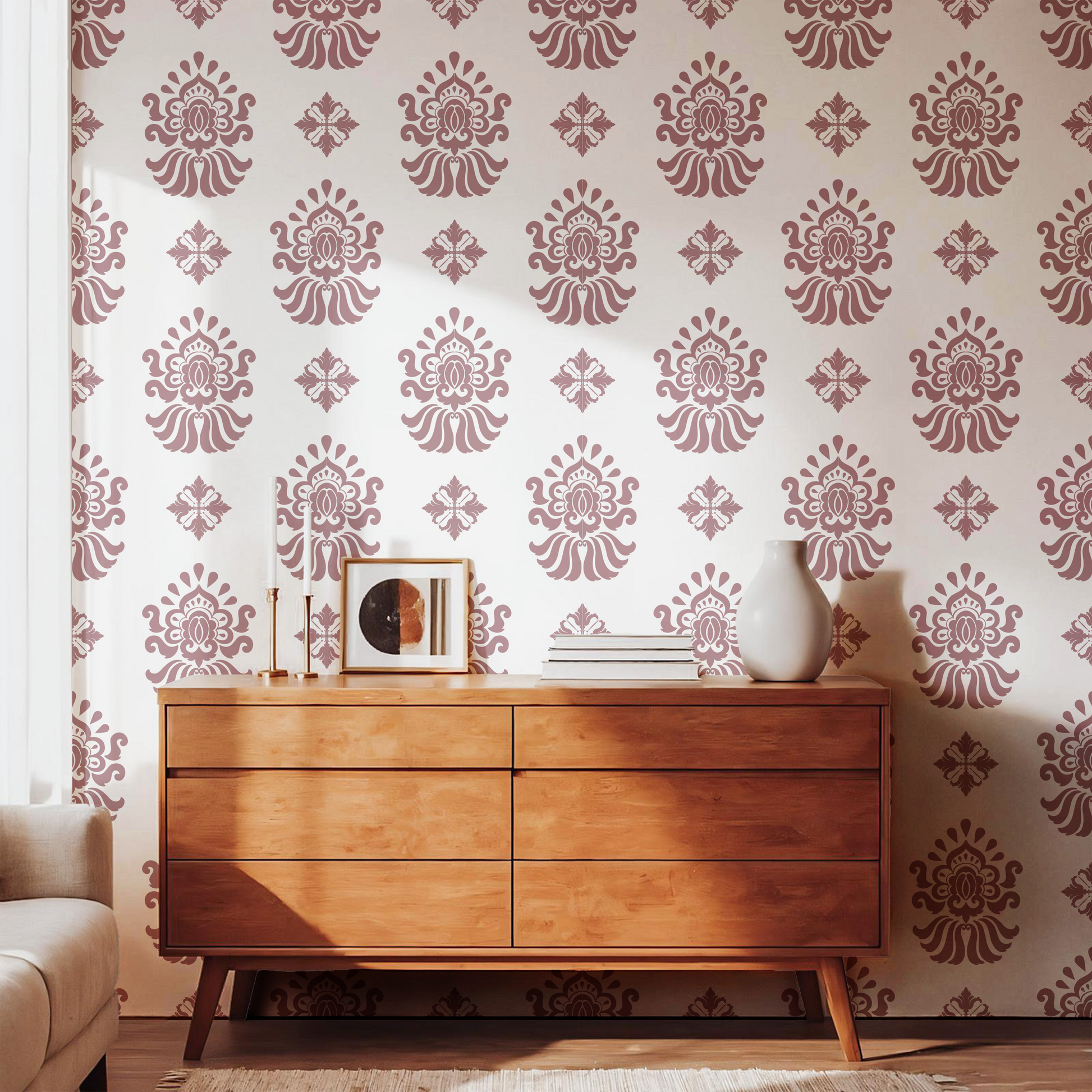 Dusty pink vintage floral wallpaper styled with a warm wooden dresser
