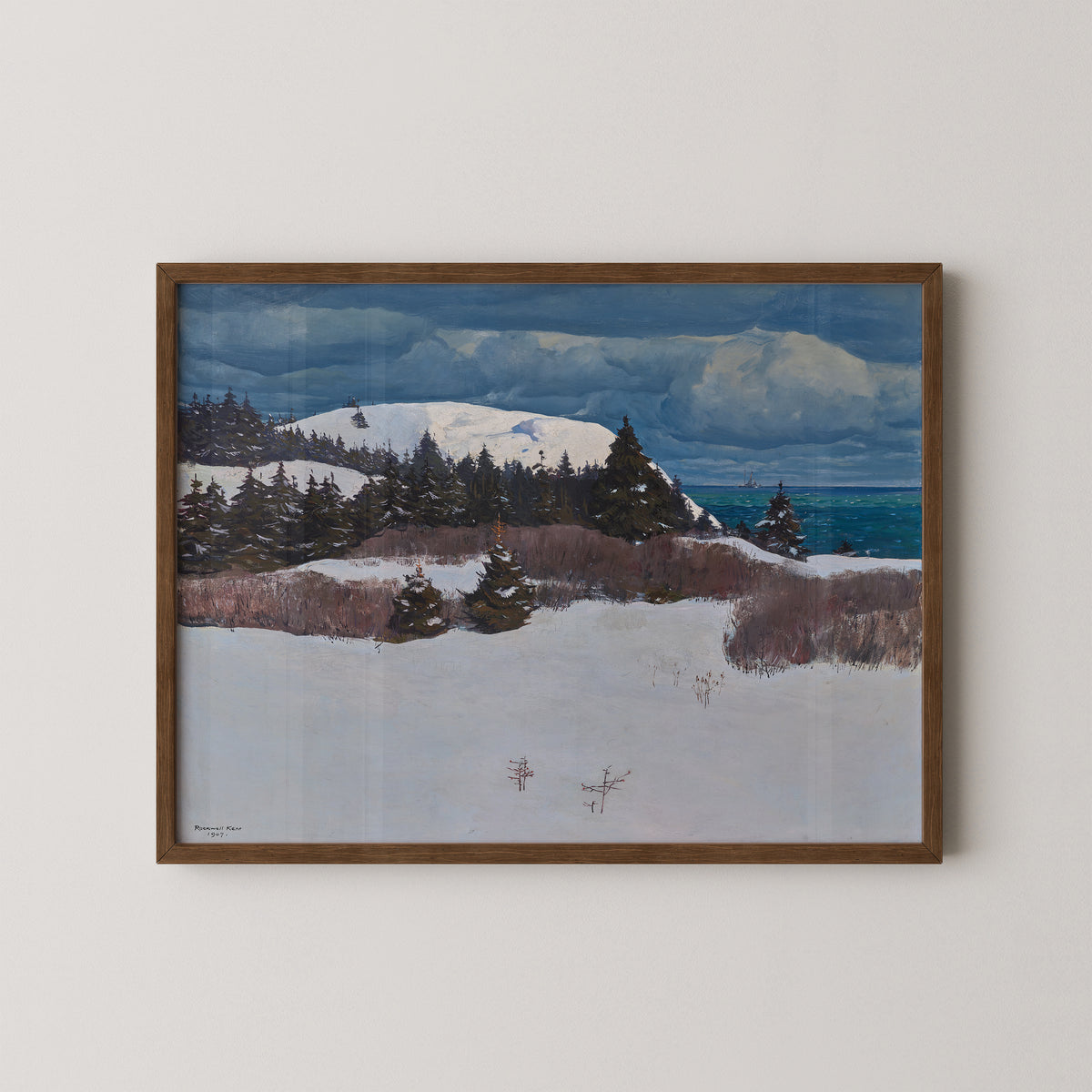 Maine Coast by Rockwell Kent, art print in a dark wood frame