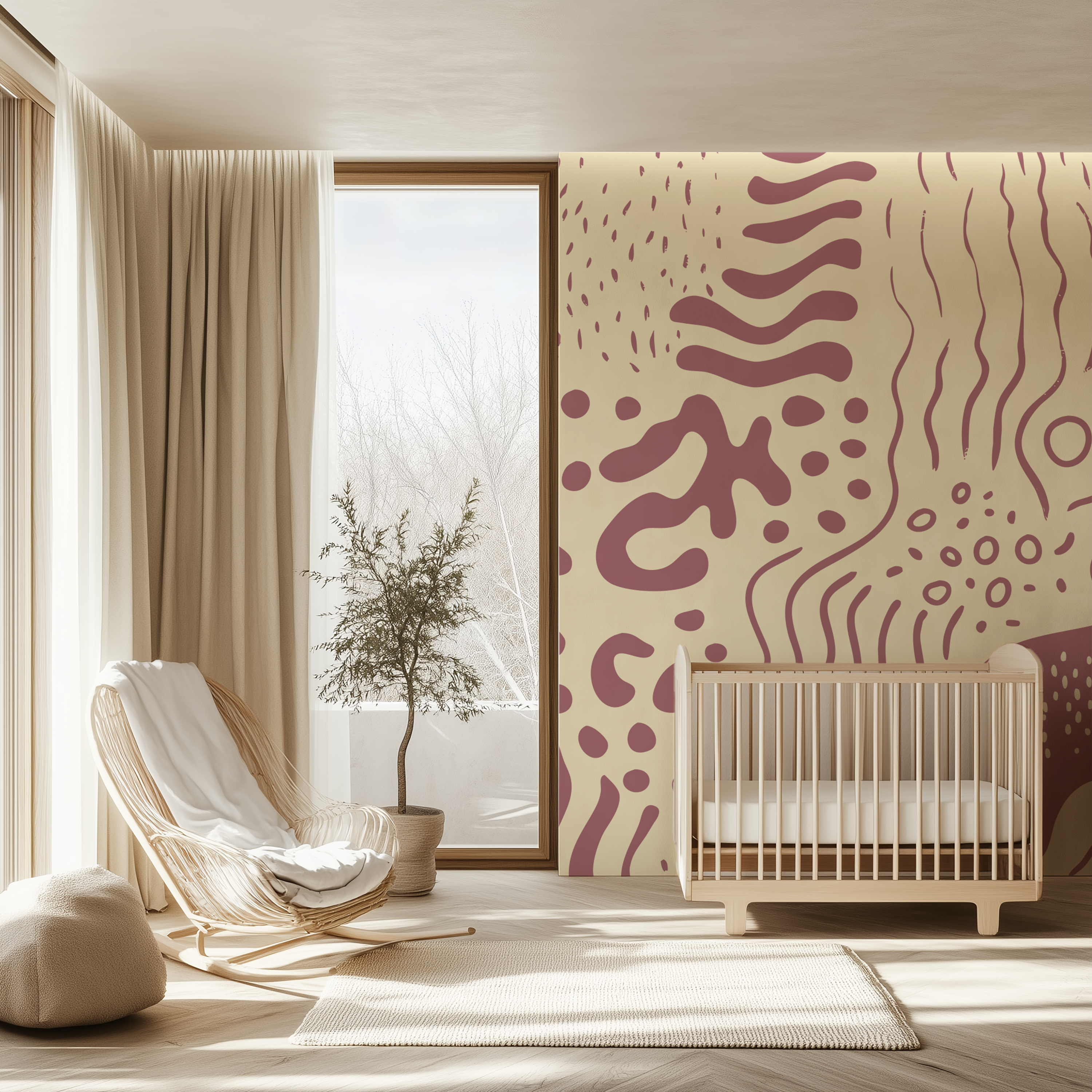 A styled nursery interior with a cream crib, rattan chair, potted tree, and a bold abstract wallpaper in mauve and cream on the wall.