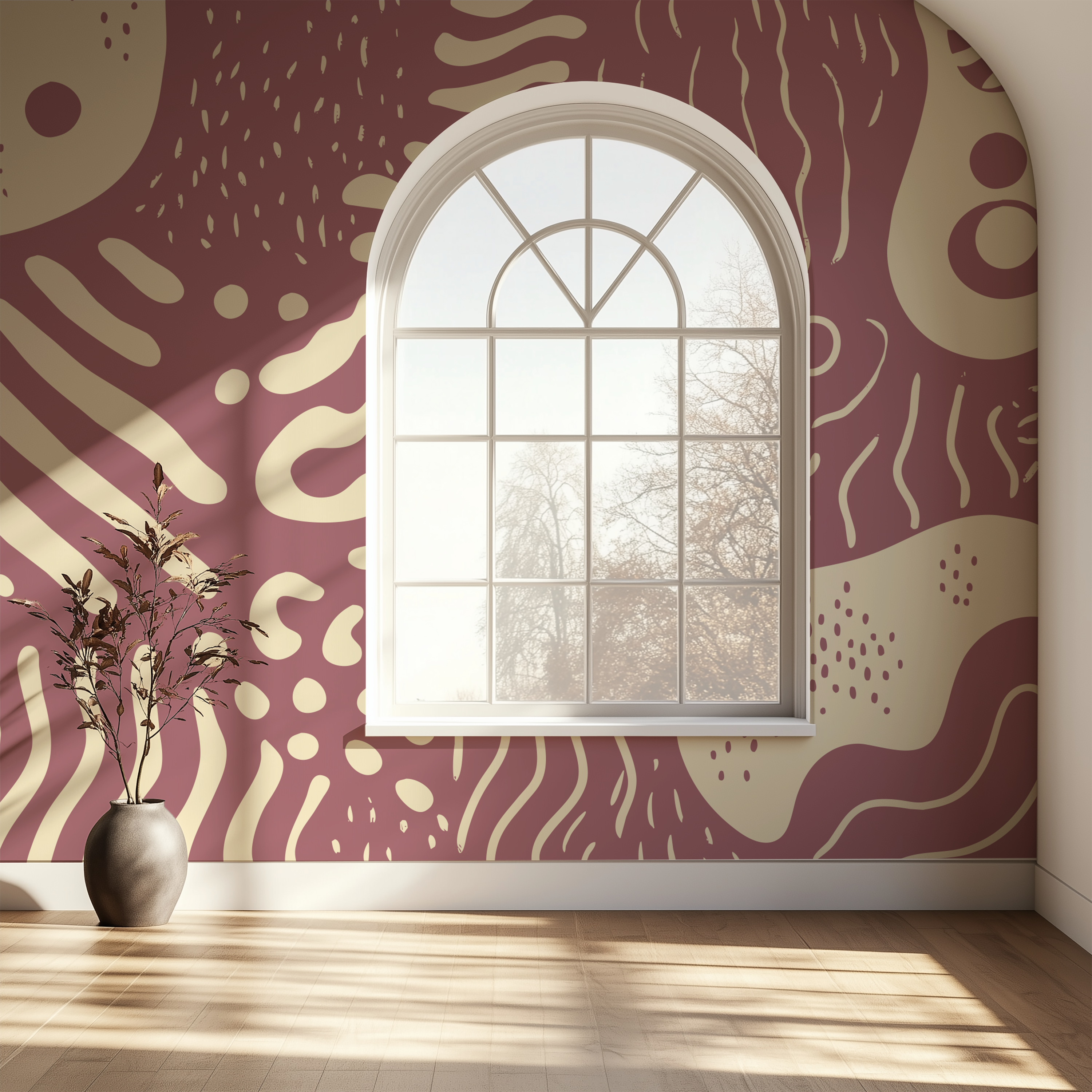 Dusty rose abstract wallpaper surrounding an arched window in a bright contemporary interior with warm natural light