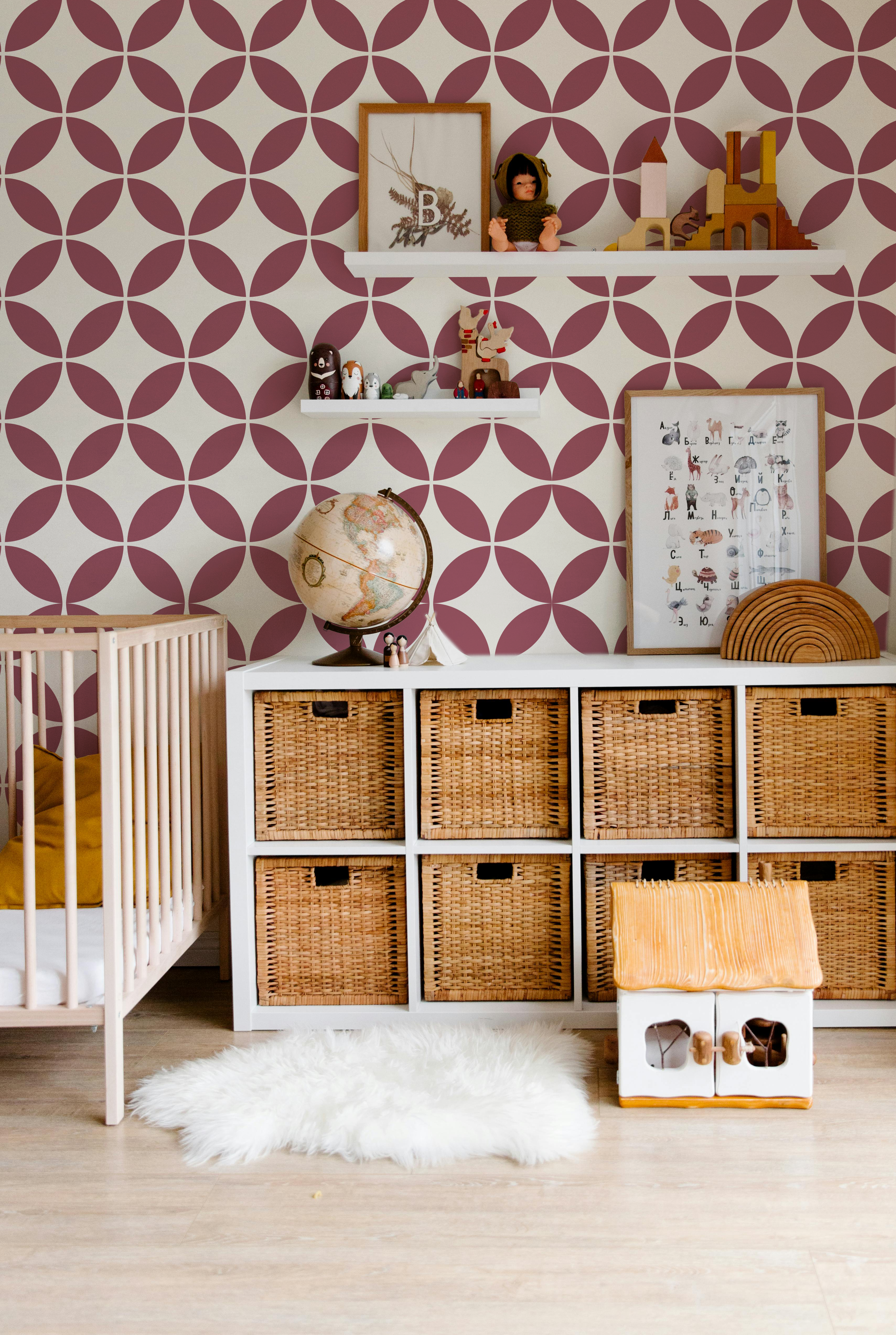 Burgundy and cream geometric wallpaper styled in a modern kids room
