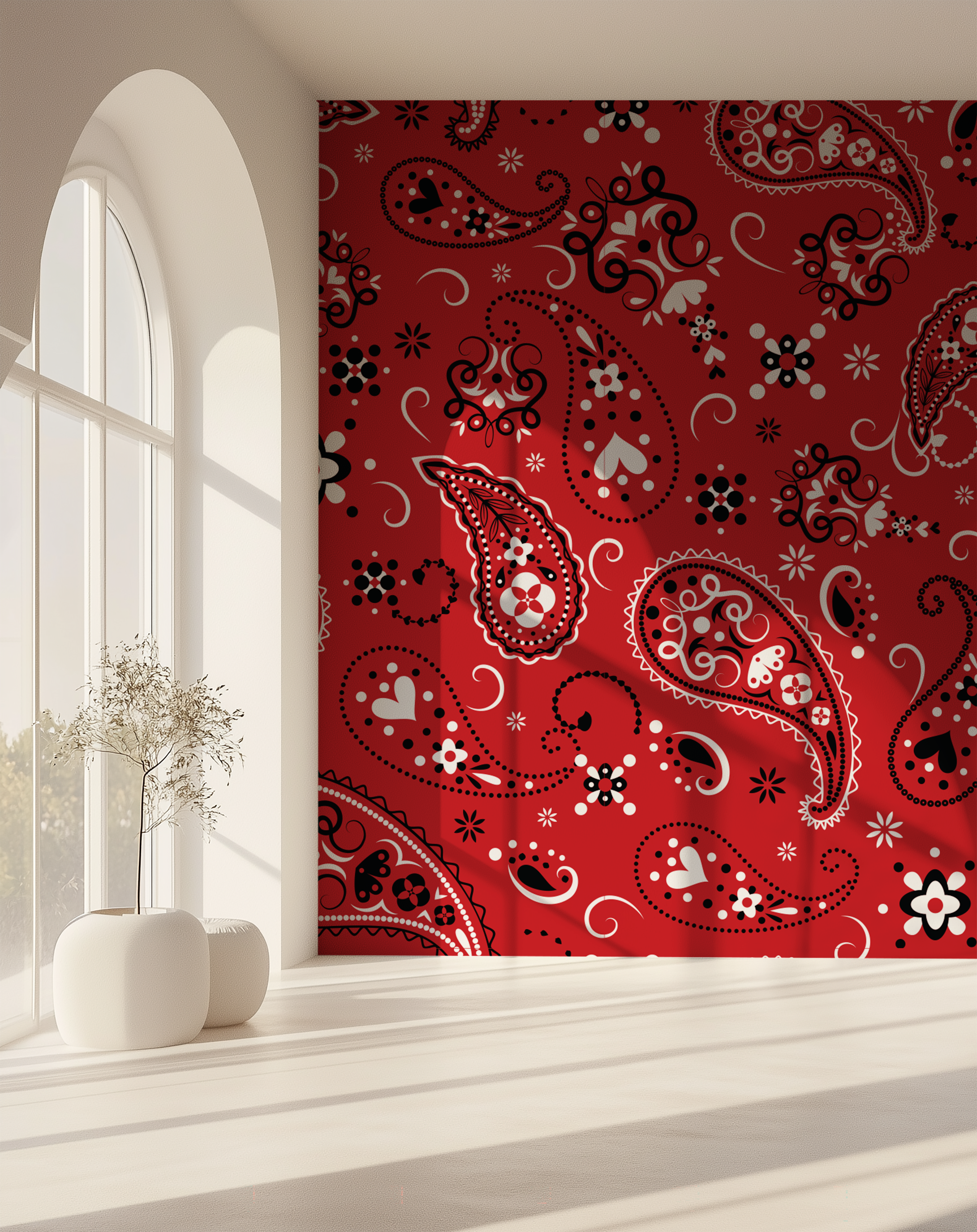 Paisley Crimson Red Bandana Wallpaper displayed as a statement wall beside a large arched window with natural sunlight.