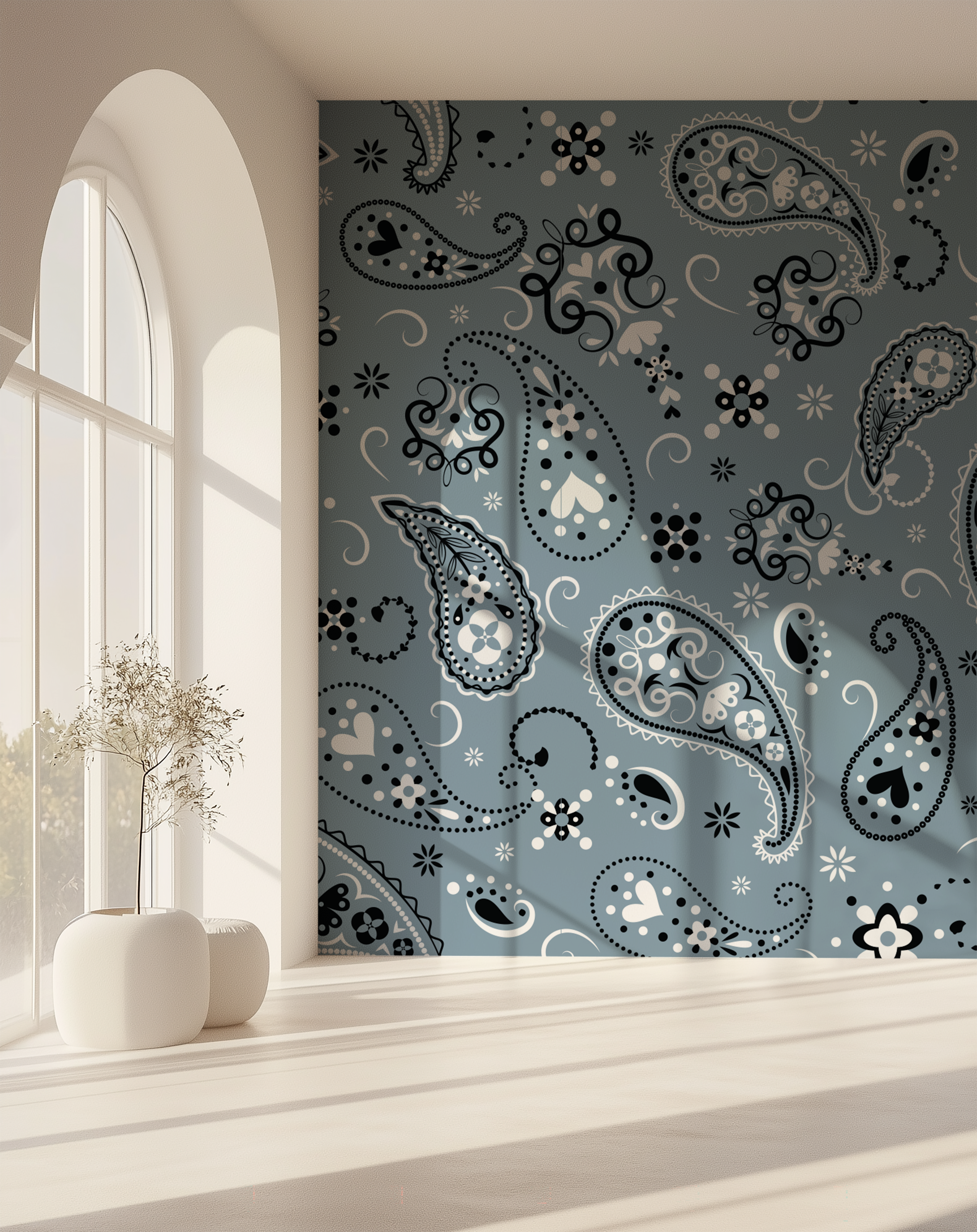 Paisley Slate Blue Bandana Wallpaper displayed as a statement wall beside a large arched window with natural sunlight.