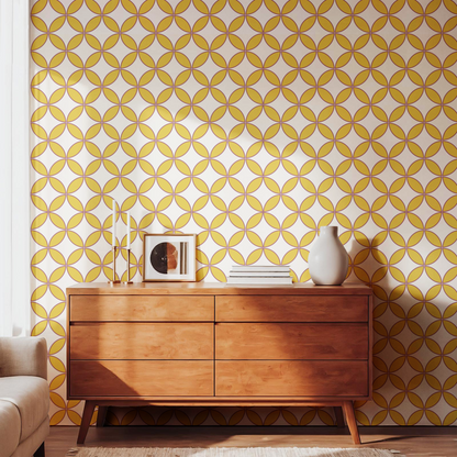 Mustard geometric pattern wallpaper styled with a warm wooden dresser
