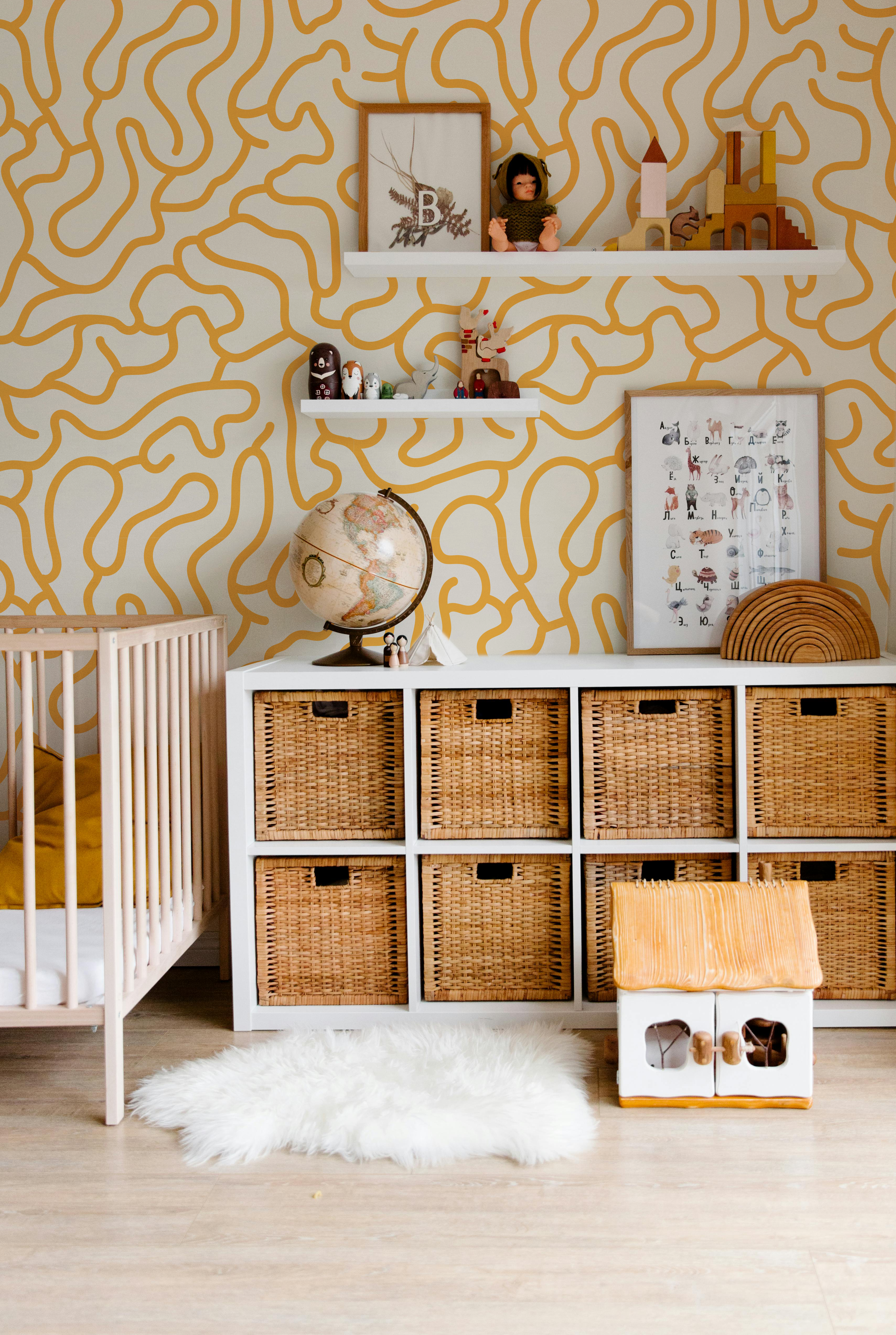 Mustard and cream abstract wallpaper with playful organic lines in a modern nursery