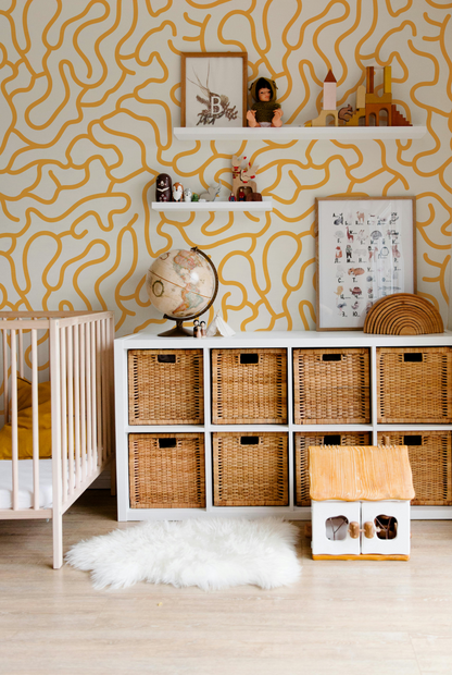 Mustard and cream abstract wallpaper with playful organic lines in a modern nursery