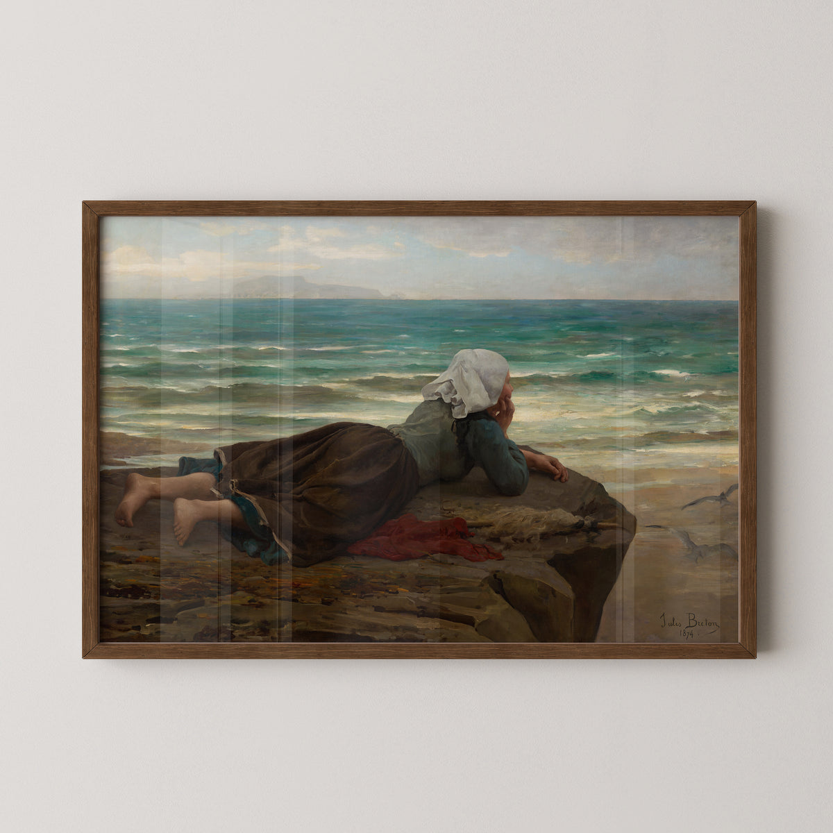 Dark wood-framed The Cliff, with a white head covering and red cloth against earthy coastal tones