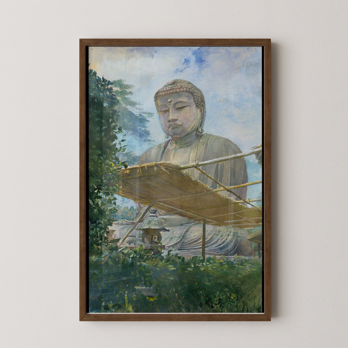 Dark wood-framed Kamakura Buddha art print with muted green foliage, a brown roof and the softly shaded statue