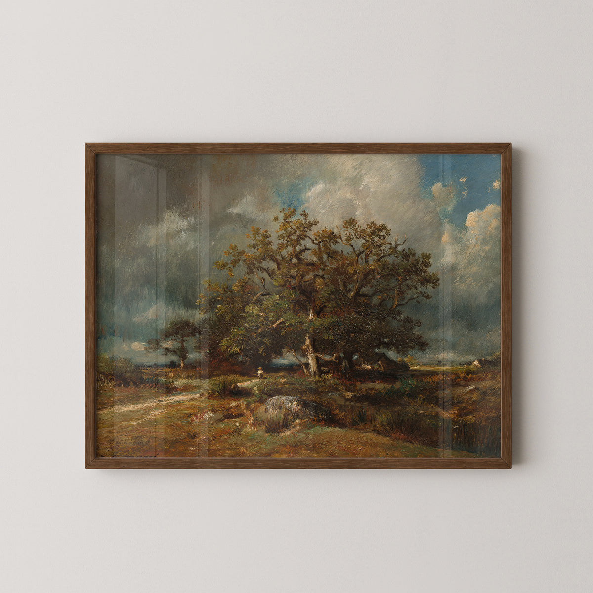 The Old Oak by Jules Dupré art print in a dark wood frame, with weathered oak beneath a dramatic sky