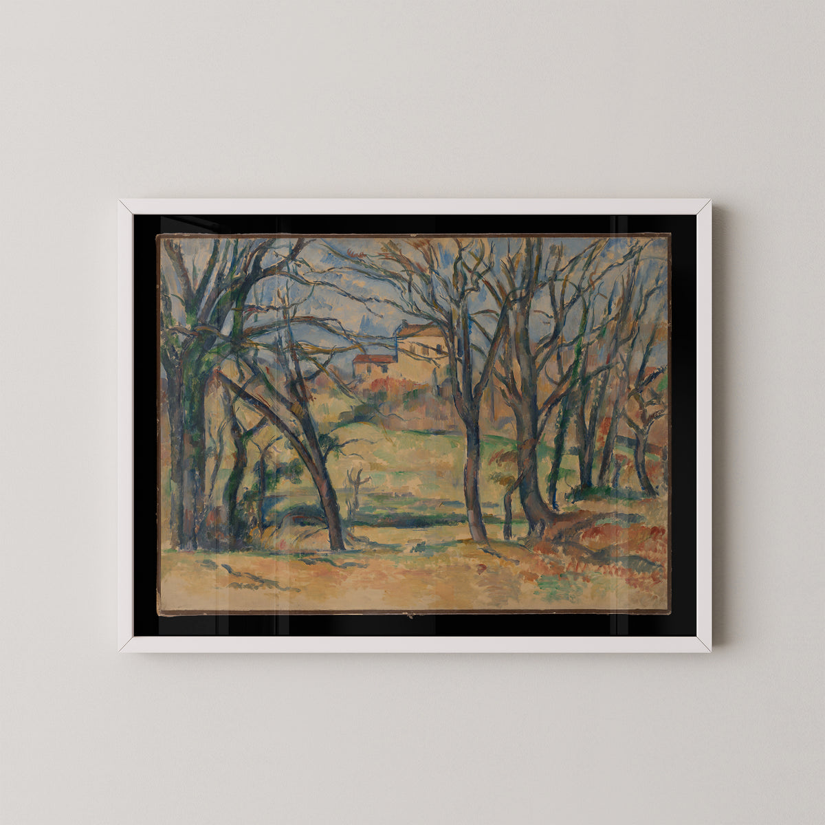 White-framed Cézanne print of the landscape near Jas de Bouffan, with pale sky, houses and open ground