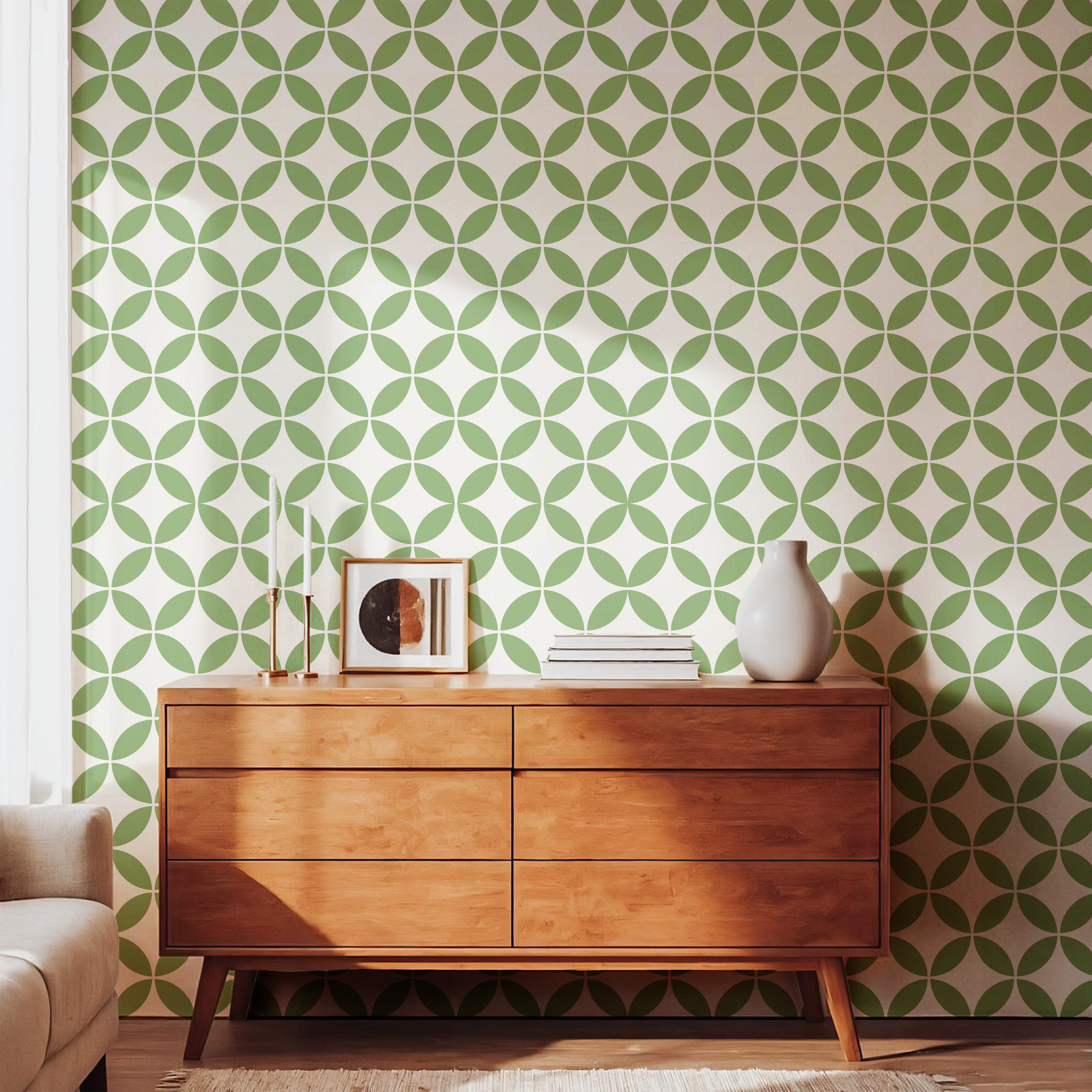 Green geometric pattern wallpaper styled with a mid-century wooden dresser
