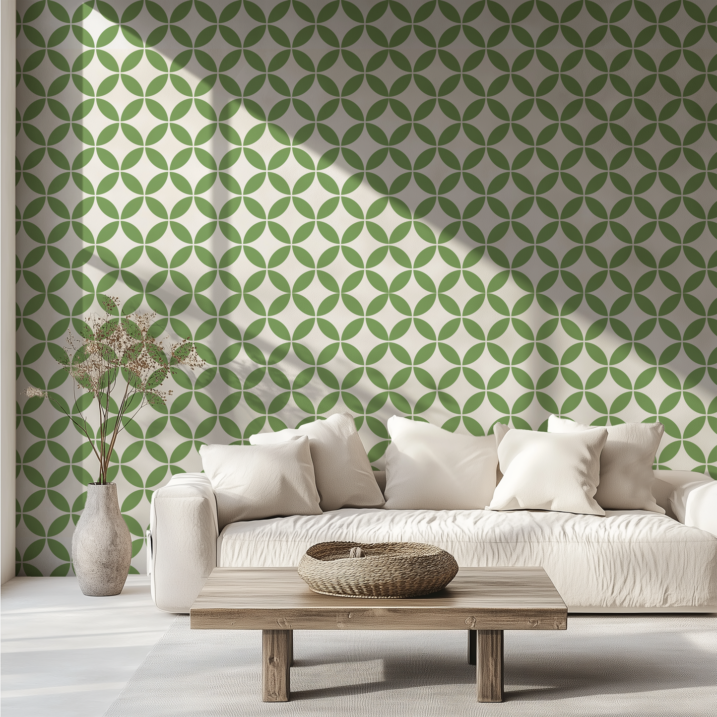 Green retro geometric wallpaper with interlocking circles behind a white sofa