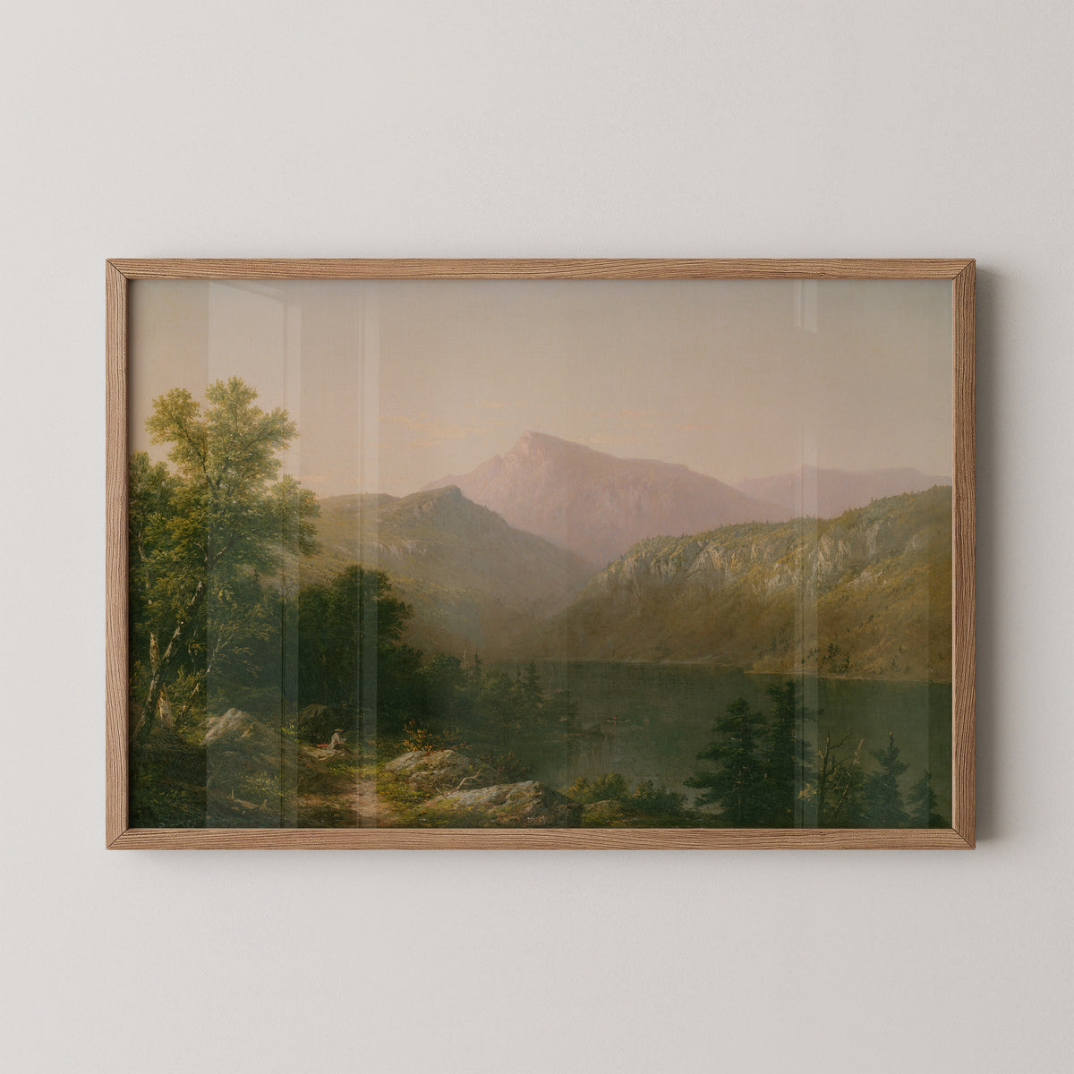 Natural wood-framed Casilear print with a rocky lakeshore, leafy trees and pale blue mountains