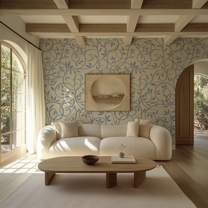 Dusty blue botanical vine wallpaper styled in a soft modern living room