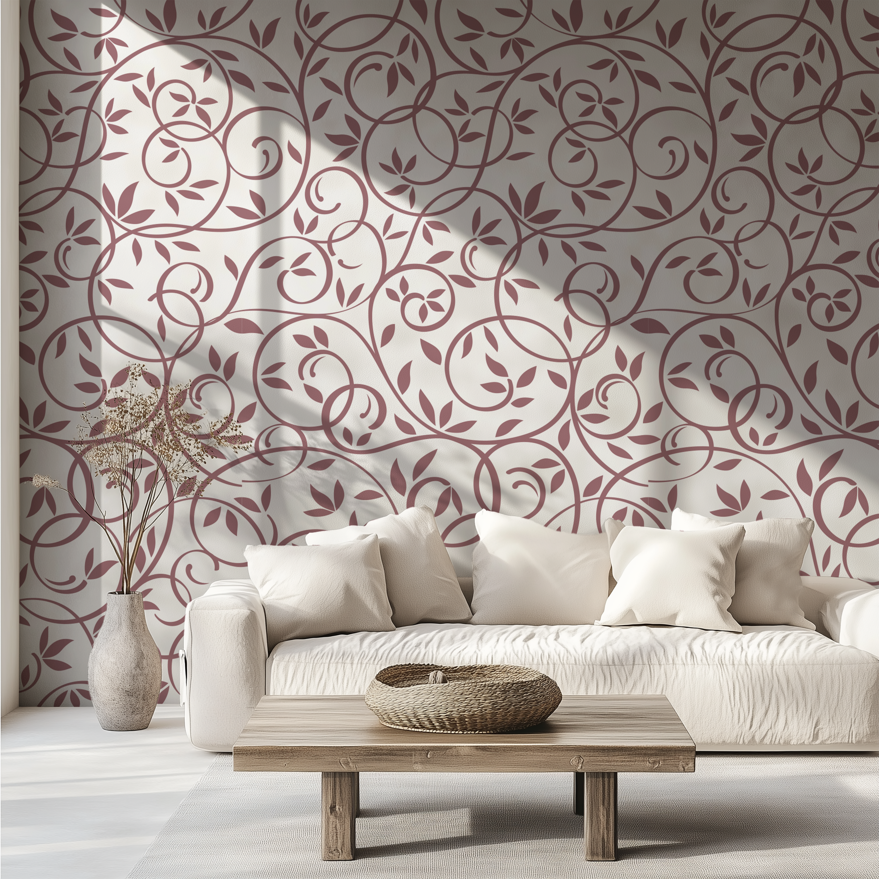 Dusty rose floral vine wallpaper styled behind a neutral sofa