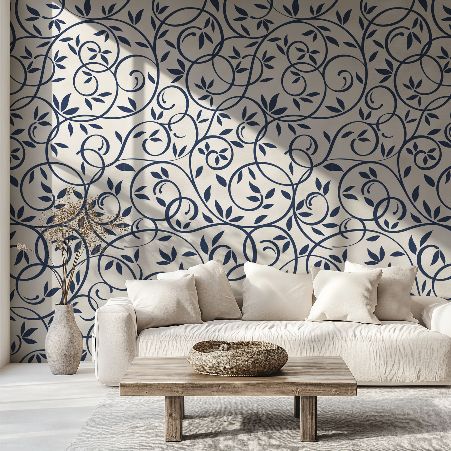 Navy blue floral vine wallpaper styled behind a neutral sofa