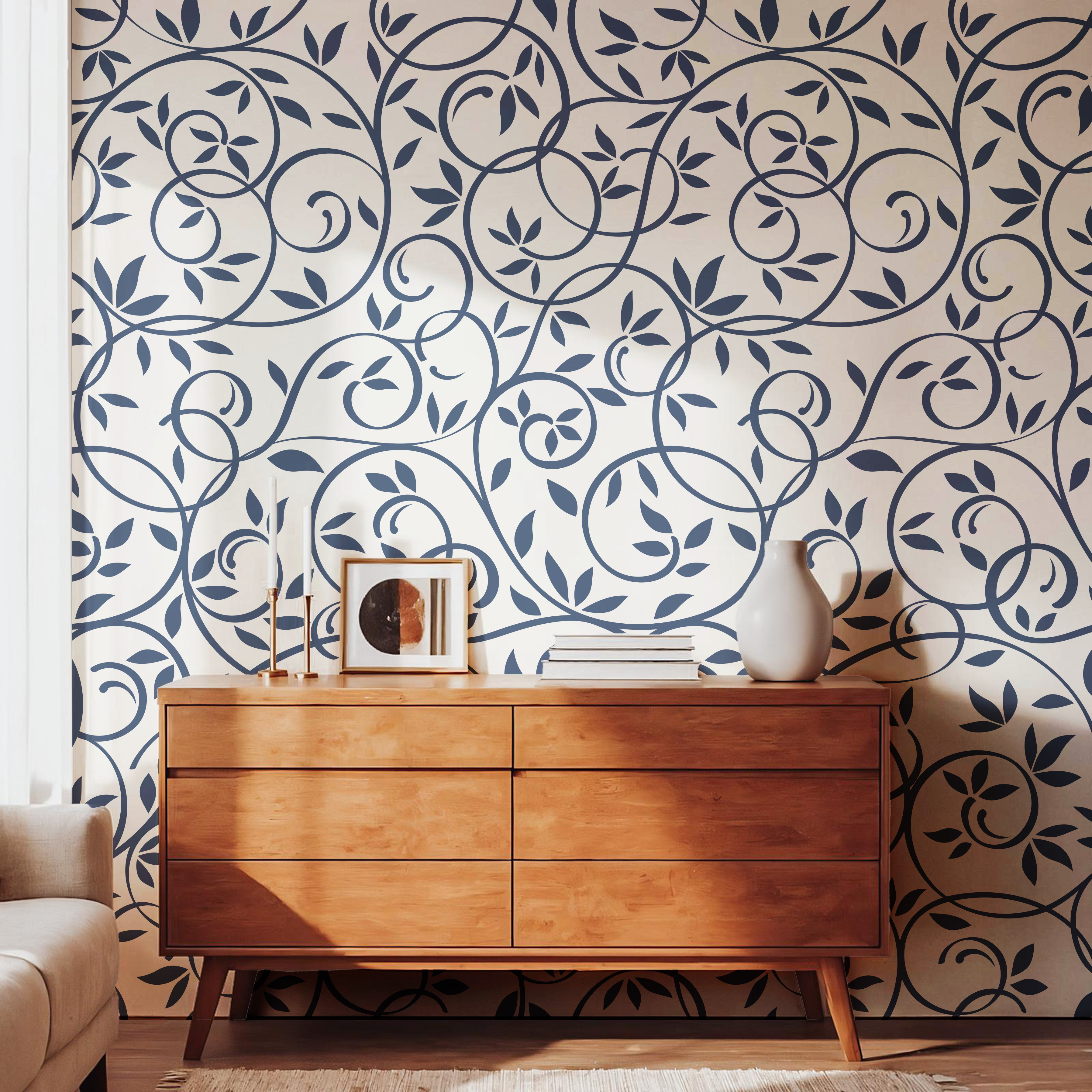Navy blue leaf and vine wallpaper styled with a warm wooden dresser