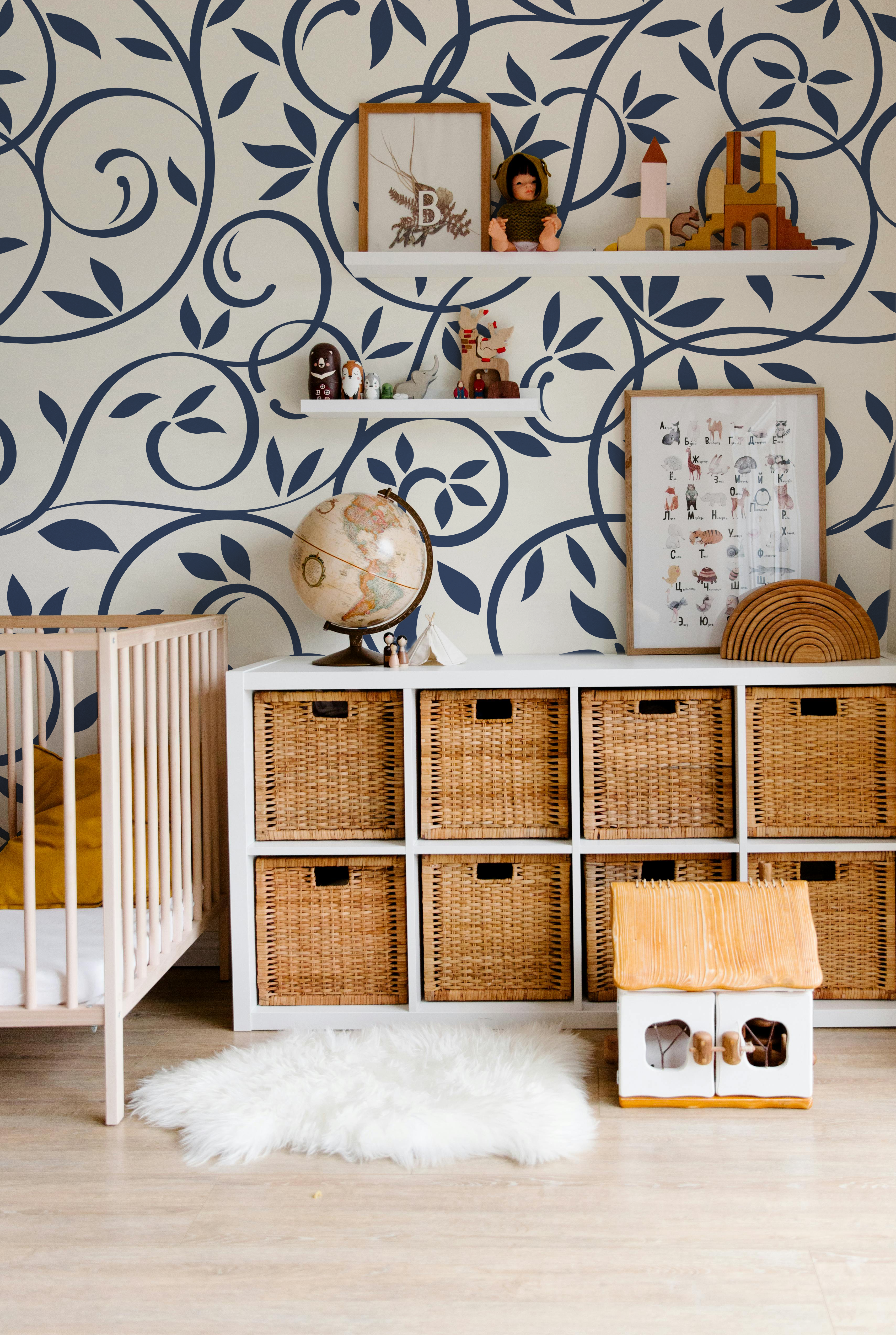 Navy blue floral vine wallpaper styled in a sophisticated dining room