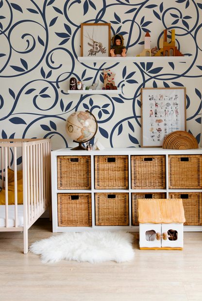 Navy blue floral vine wallpaper styled in a sophisticated dining room