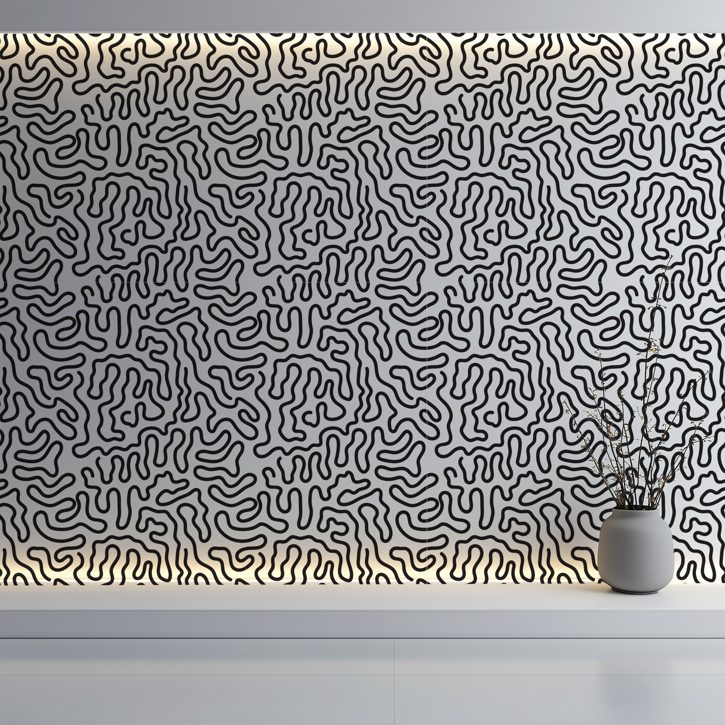 A wall covered in a dense black abstract line pattern on a white background, with warm light along the top edge and a small gray vase with dried stems on a white shelf in the lower right.