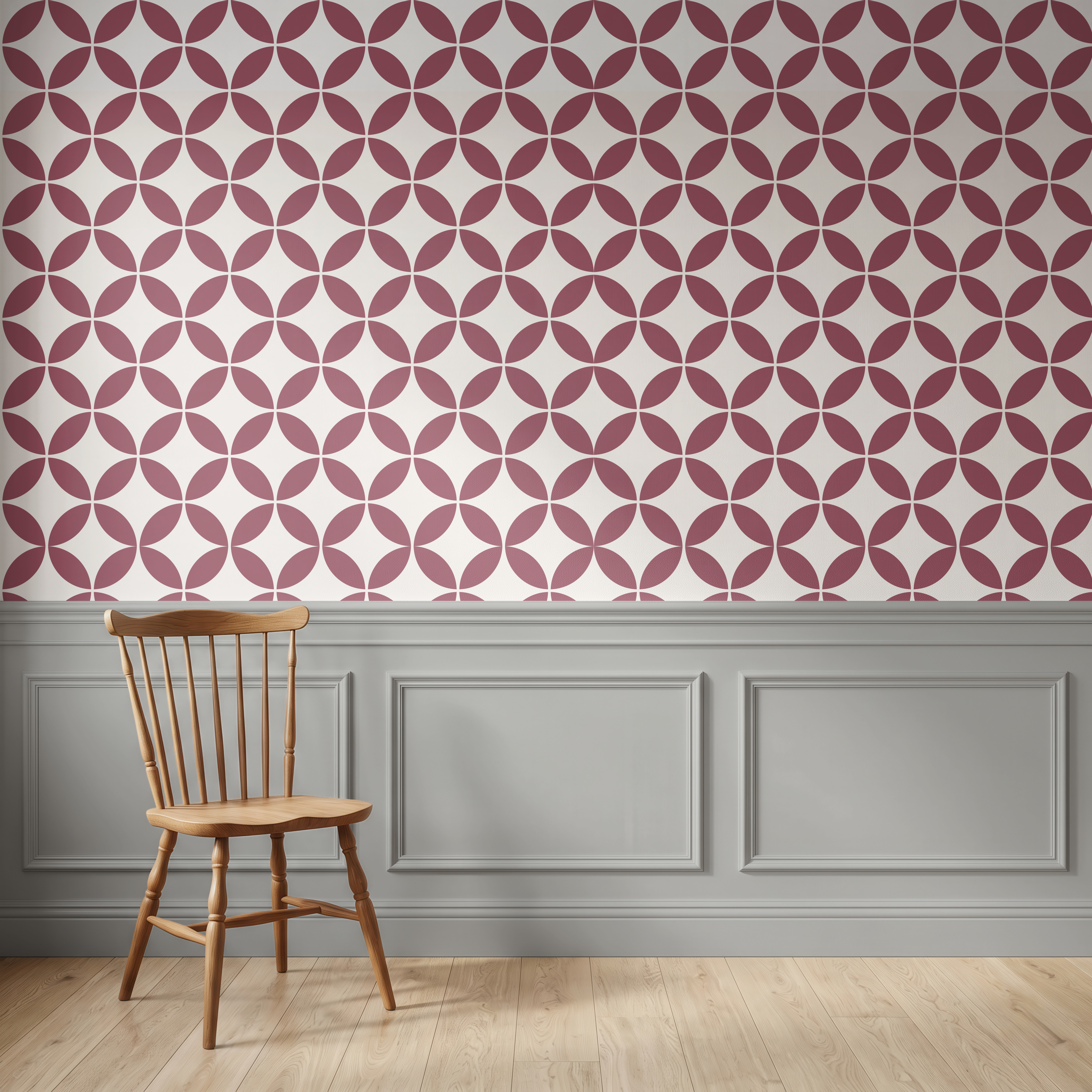 A room scene showing a light blue and white geometric patterned wallpaper on the upper wall, gray wainscoting along the lower wall, a light wood floor, and a wooden spindle-back chair in the lower left.
